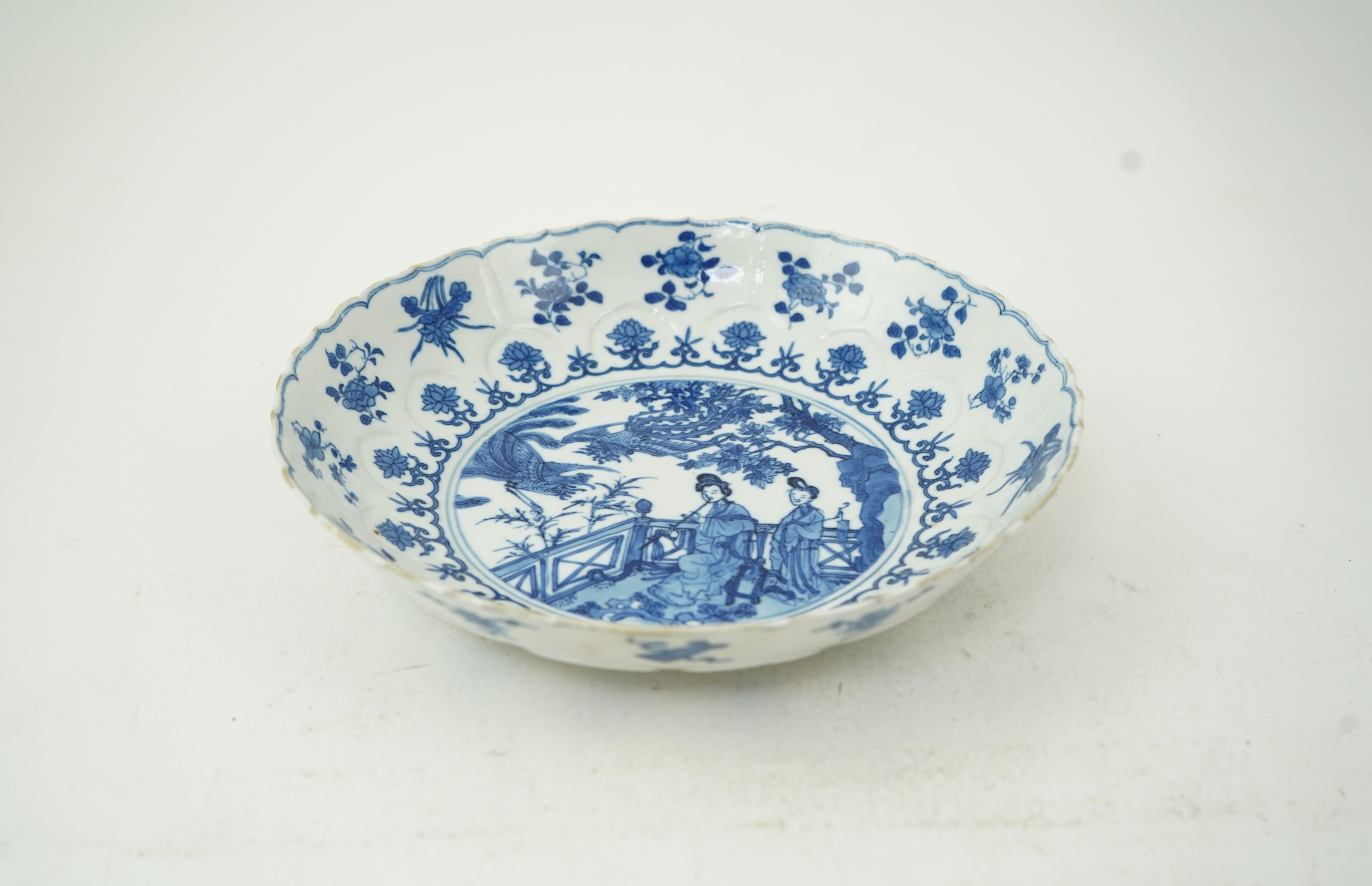 A Chinese blue and white ‘ladies and phoenix’ dish, Kangxi period